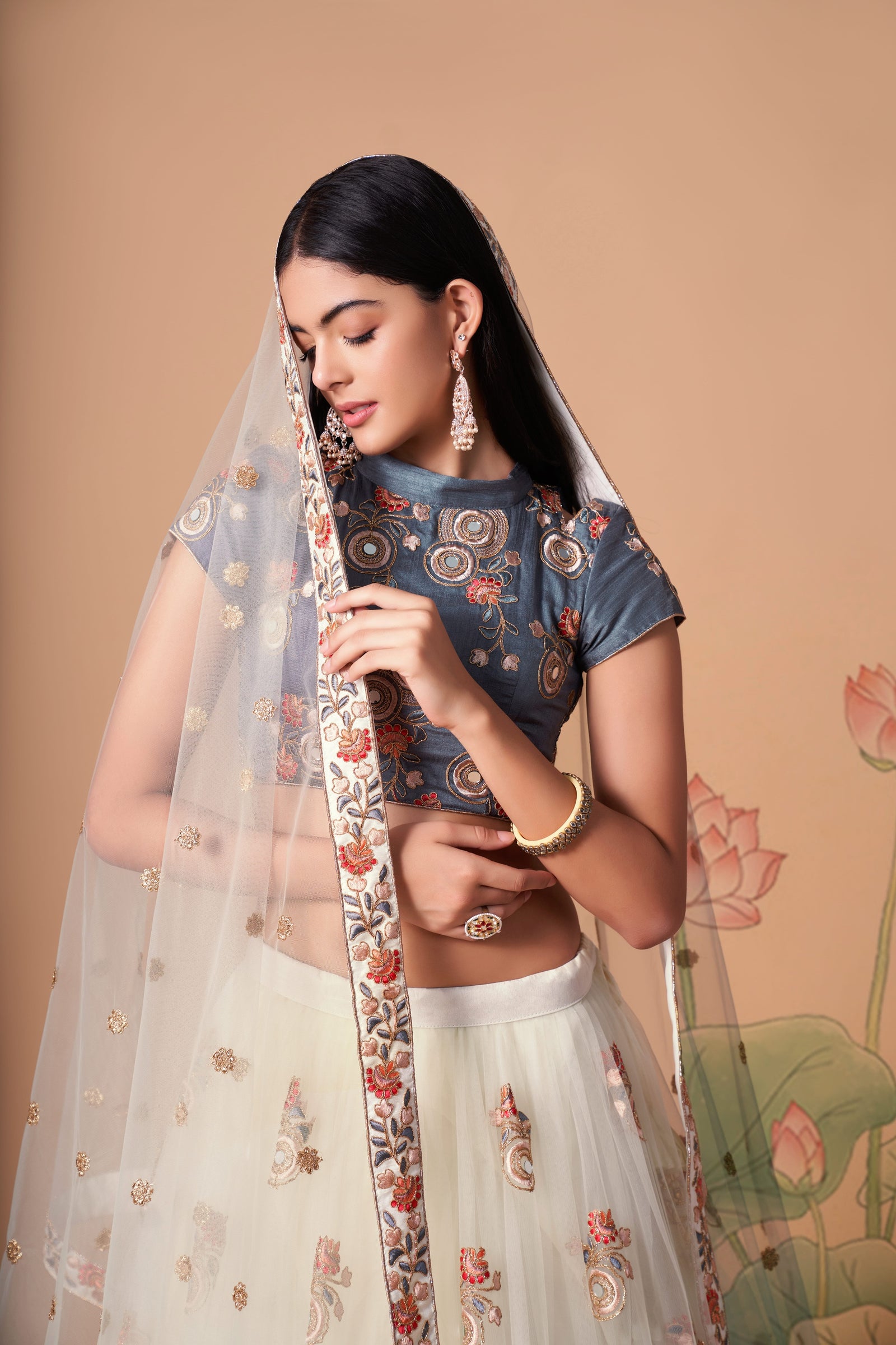 Off White Soft Net Mirror Embroidered Lehenga Choli Set